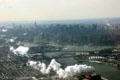 Manhattan skyline over Triborough Suspension & arched Hell's Gate railway bridges from air. New York, NY.