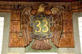 Eagle with #33 shield tiles in 33rd St. subway station by Grueby Faience Company. New York, NY.