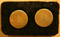 Two copper buttons from Washington's waistcoat during American Revolution at Federal Hall. New York, NY.