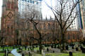 Gothic Revival features of Trinity Church over graveyard. New York, NY.
