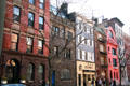 Townhouses along Waverly Place off Washington Square including #108 with crenellations dating back to 1826. New York, NY.
