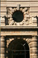 Round window & columns surround door of Flatiron Building. New York, NY