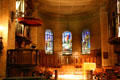 Interior of St. Paul's Chapel with stained glass by John La Farge at Columbia University. New York, NY.