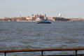John James Audubon tour boat cruises past Ellis Island. New York, NY.