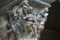Devils with sinners going to hell carved on capital of Saint-Guilhem Cloisters at The Cloisters. New York, NY.