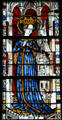 Virgin Mary in robe with wheat stained glass from the church at Boppard-am-Rhein at The Cloisters. New York, NY.