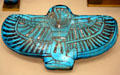 Funerary blue amulet of kneeling god with wings from Egypt early Ramesside period at Metropolitan Museum of Art. New York, NY