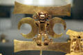 Cast gold masked figure pendant of Veraguas culture, Panama at Metropolitan Museum of Art. New York, NY.