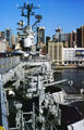 Guns of Intrepid aircraft carrier against skyline of New York City. New York, NY.