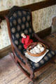 Rocking chair in front room of German family at Tenement Museum. New York, NY.