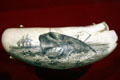 Scrimshawed whale's tooth at South Street Seaport Museum. New York, NY.