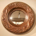 Repoussé copper mirror frame with mythical dragons by John Pearson at Metropolitan Museum of Art. New York, NY.