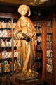 Statue of St Elizabeth holding book in Antique library at Morgan Library. New York City, NY.