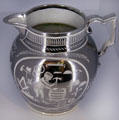 Earthenware silver luster pitcher from Henry Powell of England with design of Masonic symbols at Brooklyn Museum. Brooklyn, NY.