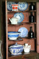 Corner hutch with blue painted porcelain at Conference House. Staten Island, NY.