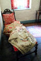 Chaise longue with early American quilt at Conference House. Staten Island, NY.