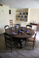 Servants' dining room with Federal era round table & chairs at Lindenwald. Kinderhook, NY.