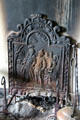 Schenck House kitchen fireplace iron backing at Old Bethpage Village. Old Bethpage, NY.