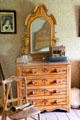 Dresser with mirror in bedroom in Layton Home at Old Bethpage Village. Old Bethpage, NY.