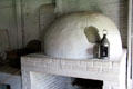 Oven with tin lantern in Powell House at Old Bethpage Village. Old Bethpage, NY.