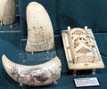 Scrimshaw objects including cribbage board at Whaling Museum. Cold Spring Harbor, NY.