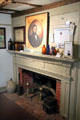 Fireplace mantel with portrait of Dr. Edgar Miles, well known citizen of Sag Harbor, at Annie Cooper Boyd House museum. Sag Harbor, NY.