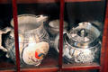 Lusterware silver teapot & pitcher with multicolor bird medallion at Home Sweet Home Museum. East Hampton, NY.