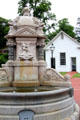 Horse trough fountain & schoolhouse at Long Island Museum. Stony Brook, NY.