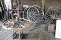 Wagon wheel repair equipment in blacksmith shop at Long Island Museum. Stony Brook, NY.
