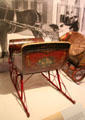 American cutter sleigh with painted scenes & borders at carriage collection of Long Island Museum. Stony Brook, NY.