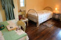 Maid's room with white coverlet on bed at Vanderbilt Mansion. Centerport, NY.