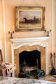 Peach guest room fireplace with horse cart painting of Lord William at Vanderbilt Mansion. Centerport, NY.
