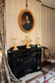 Fireplace with girandoles & portrait at Taft House NHS. Cincinnati, OH.