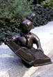 Whimsical statuette of reader in garden of Louis Stoke wing of Public Library. Cleveland, OH.