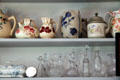 Rows of pottery pitchers & glass flasks in General Store at Milan Historical Museum. Milan, OH.