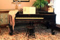 Piano belonging to Ida Saxton McKinley with girandole candlesticks in parlor at Ida Saxton McKinley Historic House. Canton, OH.