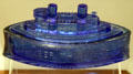 Cobalt blue glass candy dish embossed with Remember the Maine at William McKinley Presidential Museum & Library. Canton, OH