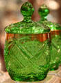 Pressed glass Fancy Loop mustard jar in emerald green at National Heisey Glass Museum. Newark, OH.