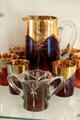 Gilded colored glass pitcher & tumblers at National Museum of Cambridge Glass. Cambridge, OH.