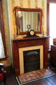 Library fireplace with mantle clock at The James Thurber House. Columbus, OH.
