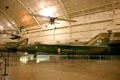 General Dynamics F-111A Aardvark under Helio U-10D Super Courier STOL at National Museum of USAF. Dayton, OH.