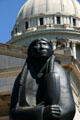 Detail of "As Long as the Waters Flow" by Allan Houser against Oklahoma State Capitol. Oklahoma City, OK.