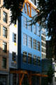 Modern residential building with orange exterior I-beams near Portland Art Museum. Portland, OR.