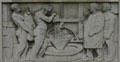 Relief of grinding grain using a millstone on Bank of America Building. Providence, RI.