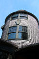 Round tower with 1882 date on shield at Isaac Bell House. Newport, RI.