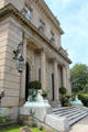 Bellevue Ave. main entrance flanked by sphinx statues at The Elms. Newport, RI.