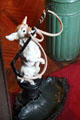 Umbrella stand in shape of dog holding whip in foyer at Kingscote. Newport, RI.