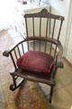 Windsor-style rocking chair with headrest extension at Kingscote. Newport, RI