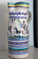Ceramic pitcher with dog chasing deer & annular stripes at Kingscote. Newport, RI.