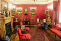 Red sitting room with pictures of horses at Marble House. Newport, RI.